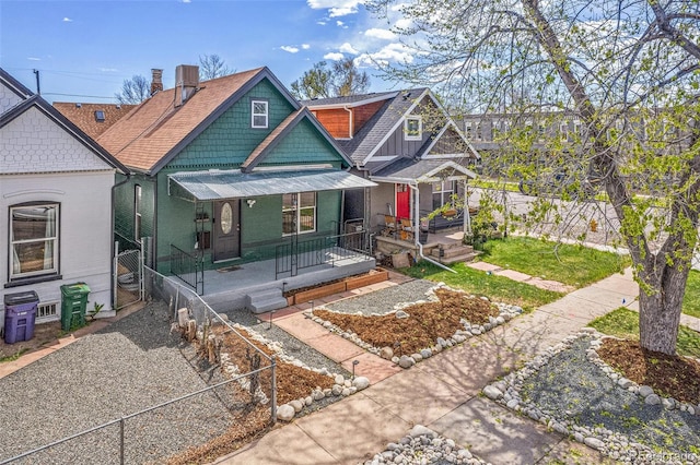 view of front of property featuring covered porch, fence, roof with shingles, and cooling unit