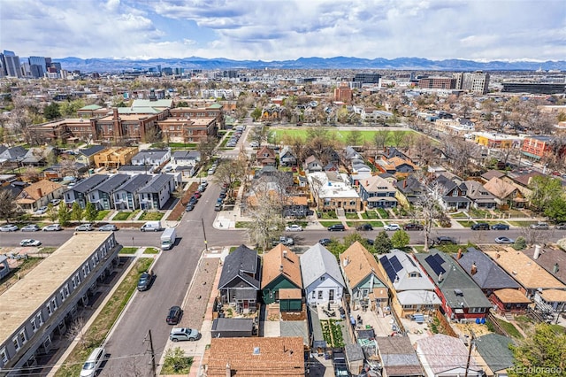 aerial view of property's location featuring a mountain backdrop