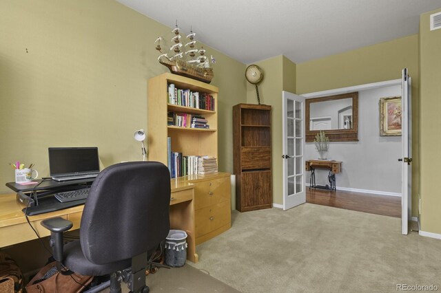 carpeted home office with french doors, visible vents, and baseboards