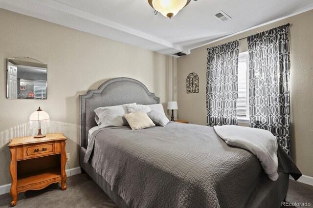 bedroom featuring visible vents, baseboards, and carpet