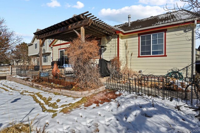 view of front of property featuring a patio area and fence