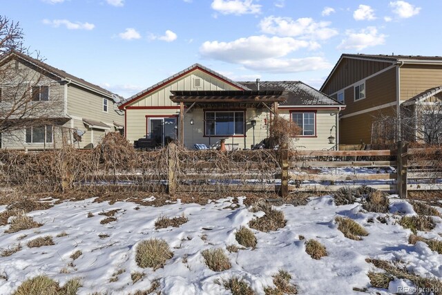 view of front of house featuring a fenced front yard and board and batten siding