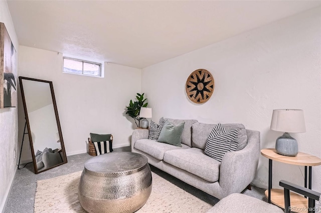 living room featuring carpet floors and baseboards