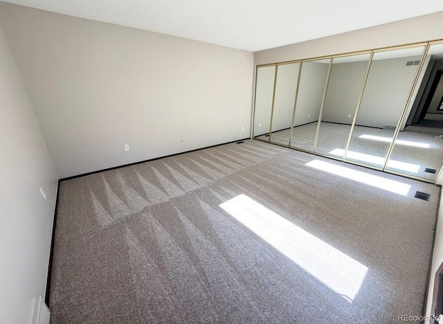 53 Douglas Dr S, Broomfield, CO 80020 - unfurnished bedroom featuring carpet floors, a closet, and baseboards