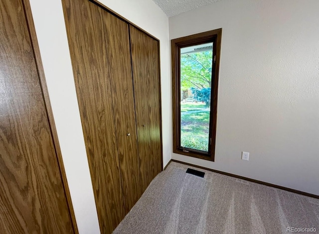 53 Douglas Dr S, Broomfield, CO 80020 - bedroom with a closet, carpet flooring, and baseboards