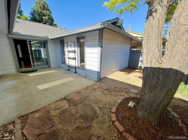 53 Douglas Dr S, Broomfield, CO 80020 - back of property with a patio area and roof with shingles