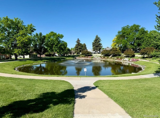 53 Douglas Dr S, Broomfield, CO 80020 - view of property's community with a lawn and a water view