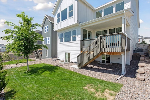 13326 Blue Amber Ct, Parker, CO 80134 - back of property with stairs, board and batten siding, a lawn, and a deck