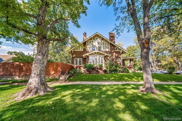 craftsman-style home with a front yard