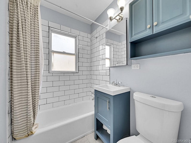 full bathroom featuring vanity, toilet, and shower / bathtub combination with curtain