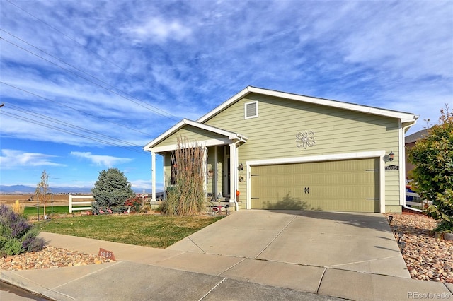 view of front facade featuring a front yard and a garage