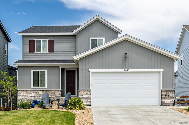9406 Bross St, Arvada, CO 80007 - view of front of home featuring stone siding, concrete driveway, a front lawn, roof with shingles, and an attached garage