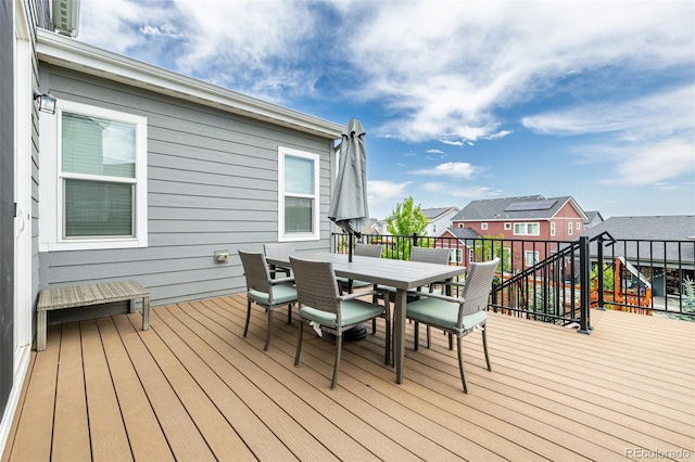 9406 Bross St, Arvada, CO 80007 - wooden deck with outdoor dining space and a residential view