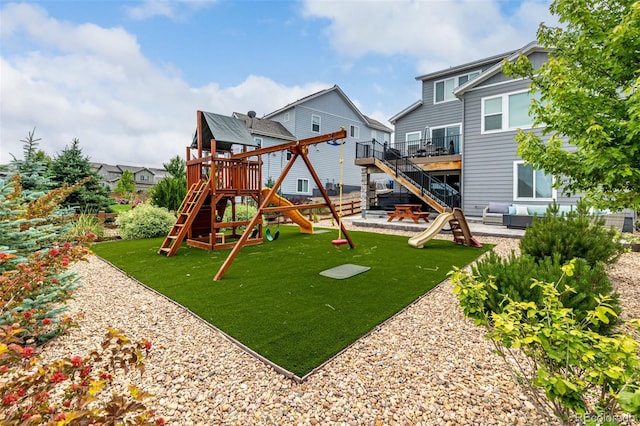 9406 Bross St, Arvada, CO 80007 - view of play area with a lawn, an outdoor living space, a wooden deck, a patio area, and stairway