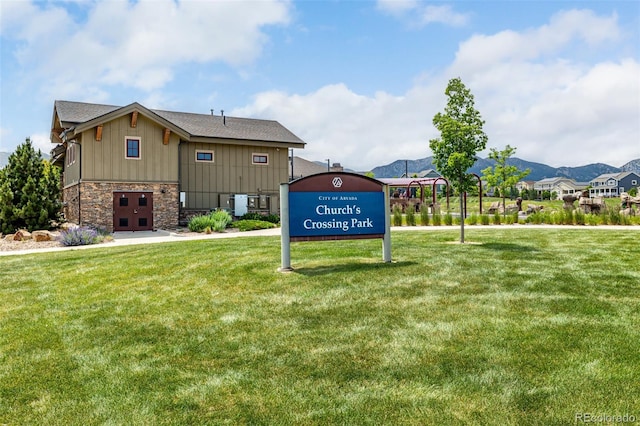 9406 Bross St, Arvada, CO 80007 - community / neighborhood sign featuring a lawn and a mountain view