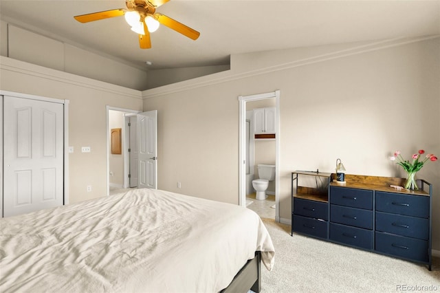 1431 Madison Ridge Hts Unit D, Colorado Springs, CO 80904 - bedroom with vaulted ceiling, light colored carpet, ensuite bathroom, a ceiling fan, and baseboards