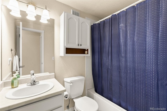 1431 Madison Ridge Hts Unit D, Colorado Springs, CO 80904 - full bathroom with vanity, a textured wall, toilet, shower / bath combo, and a textured ceiling