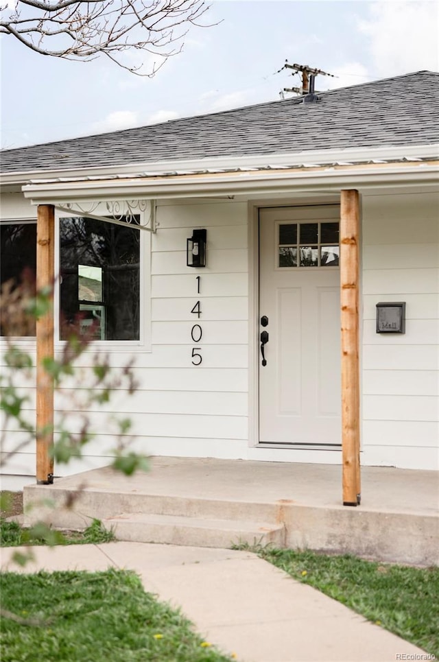1405 Eaton St, Lakewood, CO 80214 - entrance to property featuring roof with shingles and a porch