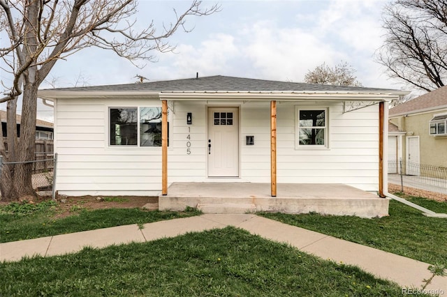 1405 Eaton St, Lakewood, CO 80214 - view of front of home with a porch and a shingled roof