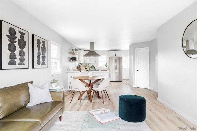 1405 Eaton St, Lakewood, CO 80214 - dining space featuring light wood-style floors and baseboards