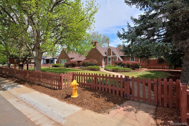 2500 Locust St, Denver, CO 80207 - tudor home with a fenced front yard and a gate