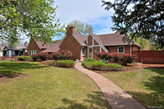 2500 Locust St, Denver, CO 80207 - english style home with brick siding, a chimney, and roof with shingles
