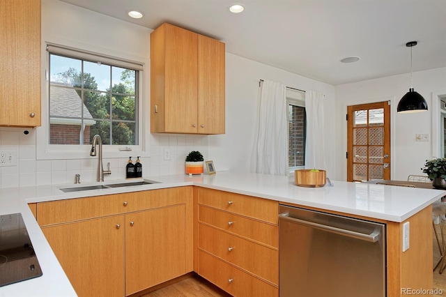 2500 Locust St, Denver, CO 80207 - kitchen featuring a sink, dishwasher, a peninsula, backsplash, and light countertops