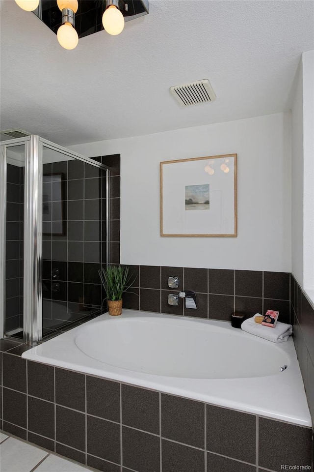 2500 Locust St, Denver, CO 80207 - full bathroom with a relaxing tiled tub and a tile shower