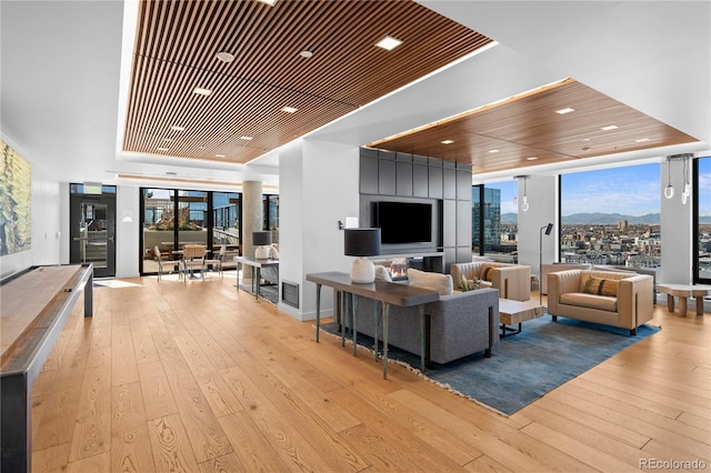 1750 Wewatta St Unit 1301, Denver, CO 80202 - living room with hardwood / wood-style flooring and recessed lighting