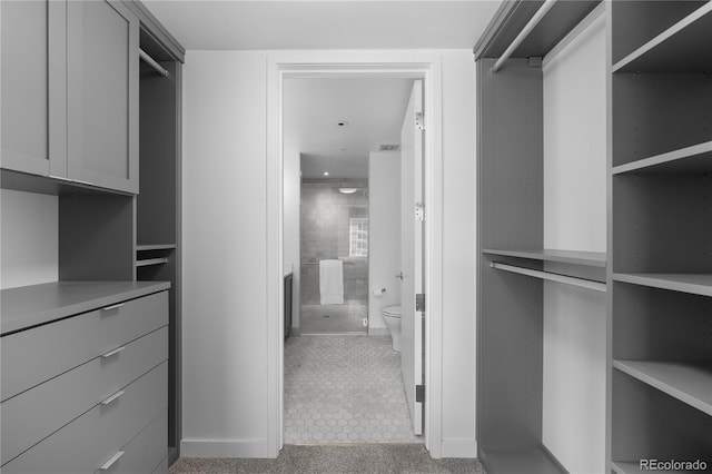 1750 Wewatta St Unit 1301, Denver, CO 80202 - walk in closet featuring tile patterned flooring