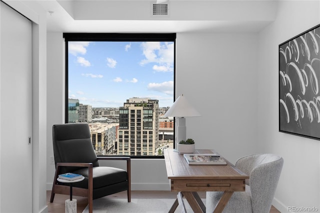1750 Wewatta St Unit 1301, Denver, CO 80202 - living area with an office area, baseboards, wood finished floors, and a view of city