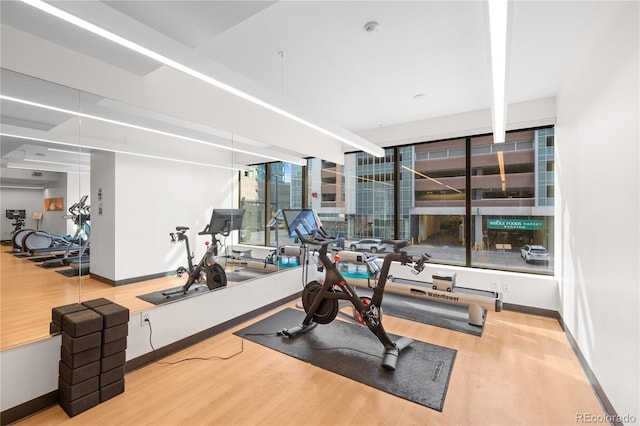1750 Wewatta St Unit 1301, Denver, CO 80202 - workout area with wood finished floors and baseboards