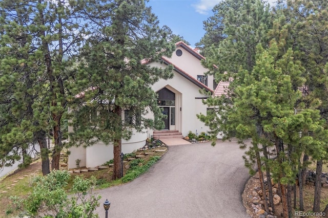 22454 Anasazi Way, Golden, CO 80401 - mediterranean / spanish home featuring stucco siding and entry steps