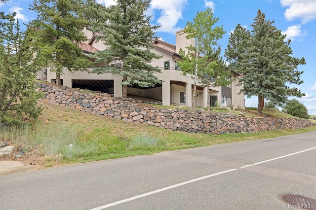 22454 Anasazi Way, Golden, CO 80401 - view of front of home featuring stucco siding and a tiled roof