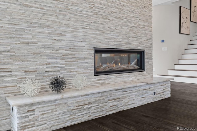 22454 Anasazi Way, Golden, CO 80401 - detailed view of wood finished floors and a glass covered fireplace