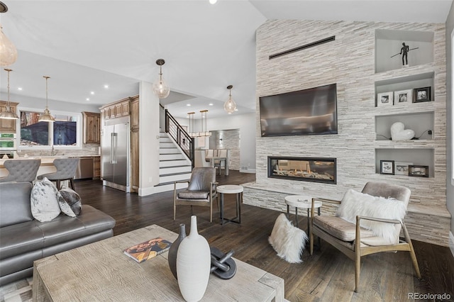 22454 Anasazi Way, Golden, CO 80401 - living room with dark wood-type flooring, stairway, a multi sided fireplace, and recessed lighting