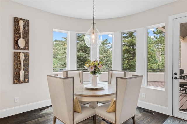 22454 Anasazi Way, Golden, CO 80401 - dining room featuring healthy amount of natural light and dark wood finished floors