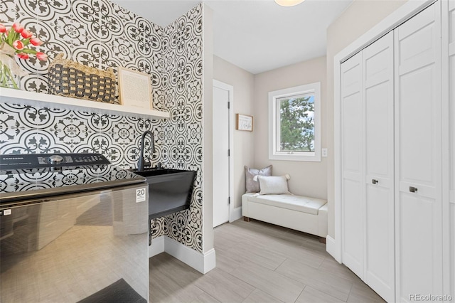 22454 Anasazi Way, Golden, CO 80401 - bathroom with a closet and wallpapered walls