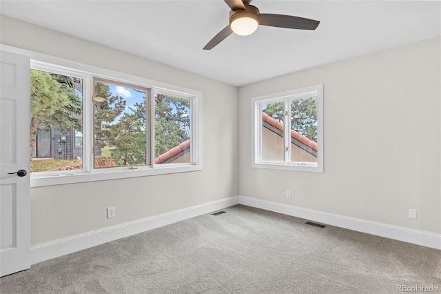 22454 Anasazi Way, Golden, CO 80401 - spare room with plenty of natural light, carpet, and a ceiling fan