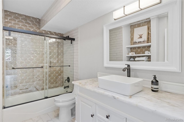 22454 Anasazi Way, Golden, CO 80401 - bathroom with vanity, bath / shower combo with glass door, and marble finish floors