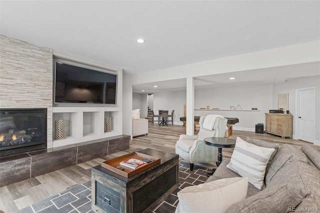 22454 Anasazi Way, Golden, CO 80401 - living area featuring wood finished floors, recessed lighting, and a tile fireplace