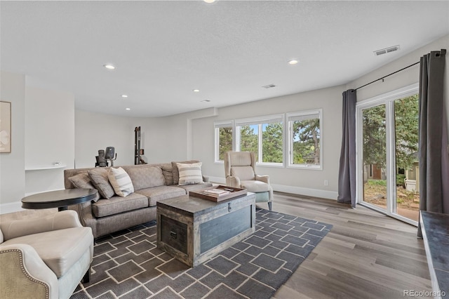 22454 Anasazi Way, Golden, CO 80401 - living area featuring healthy amount of natural light, wood finished floors, and recessed lighting