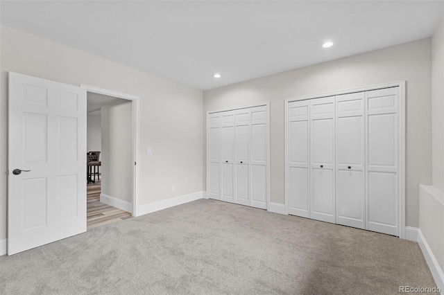 22454 Anasazi Way, Golden, CO 80401 - unfurnished bedroom featuring carpet, multiple closets, and recessed lighting