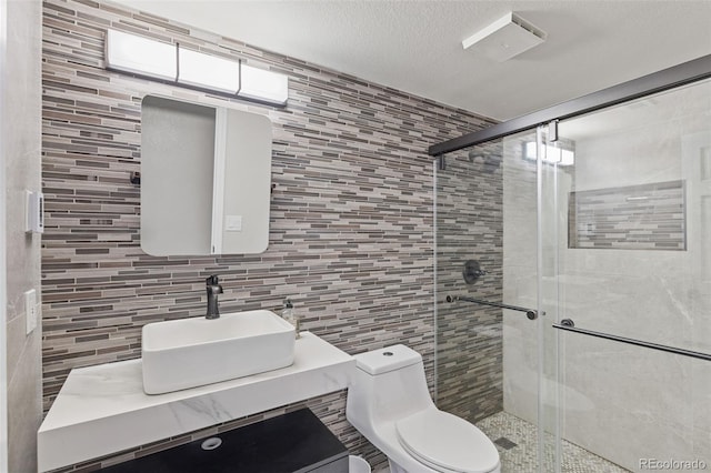 22454 Anasazi Way, Golden, CO 80401 - bathroom with tile walls, a stall shower, and vanity