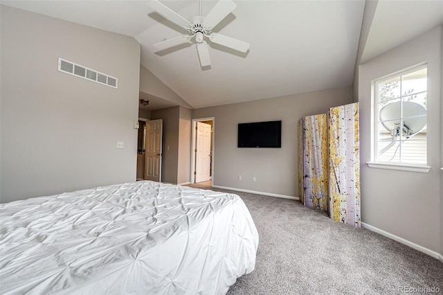 bedroom featuring lofted ceiling, carpet flooring, baseboards, and visible vents