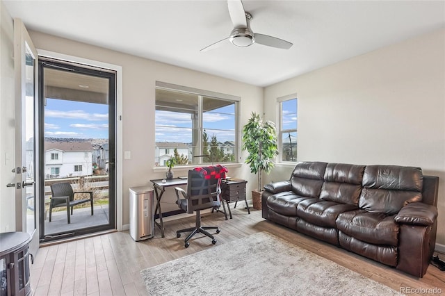 office area with ceiling fan and light wood-type flooring