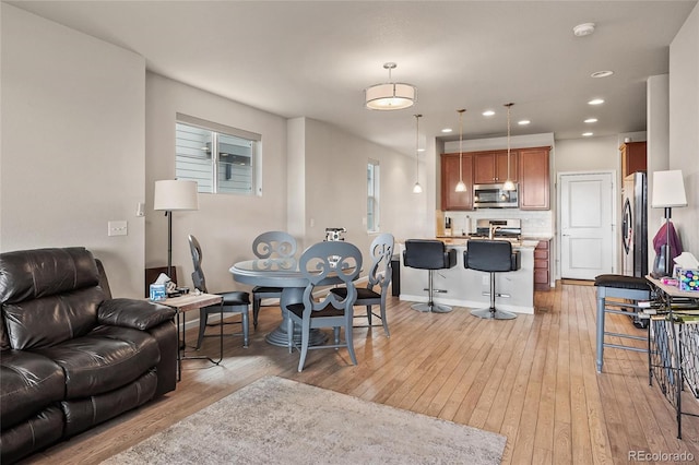 living room with light hardwood / wood-style flooring