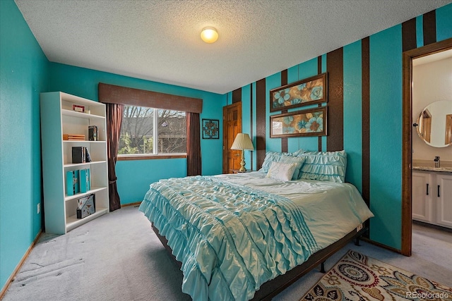 bedroom with baseboards, carpet flooring, and a textured ceiling