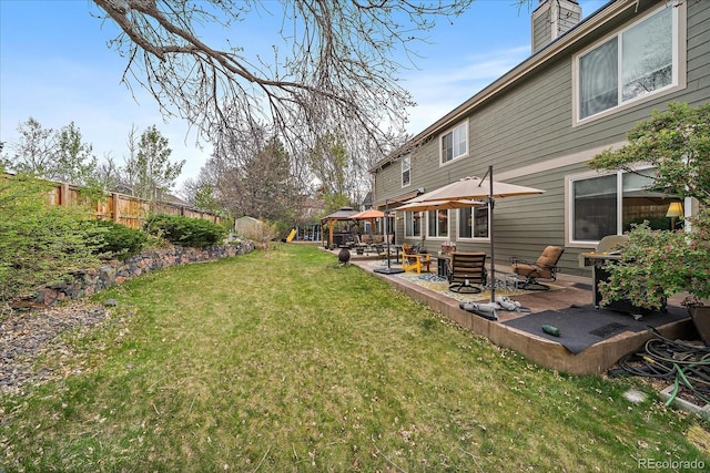 view of yard with a gazebo, fence, and a patio area