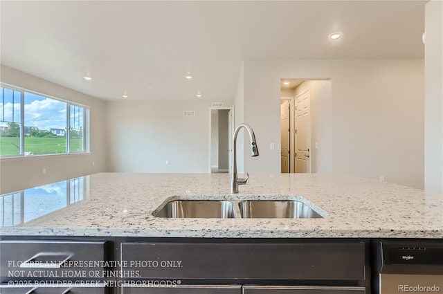 kitchen with visible vents, a sink, light stone countertops, stainless steel dishwasher, and recessed lighting